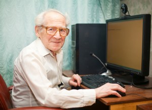 Old man at desktop compute