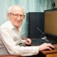 Old man at desktop compute