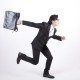 Businessman with briefcase dashing off