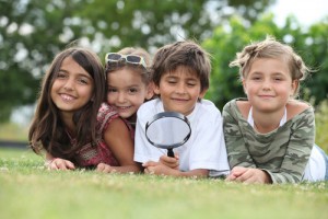 Group of children with magnifying glass