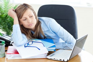 Frustrated woman staring at laptop